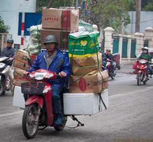 Hanoi- goods ride pillion on motorcycles Transportation in Hanoi is by motorcycle