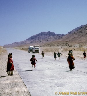 children running after 2 vans Kochi children running after a van on the Herat-Kandahar Road