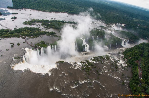 Copter view of Iguazu Falls. Devils Throat on left with viewing walkways over water | Photo: Angela Neal Grove