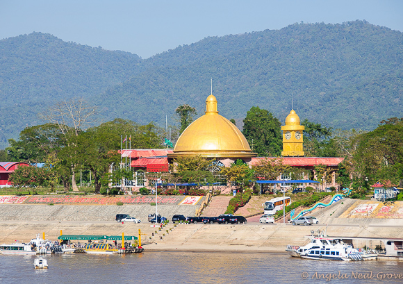 Closeup of casino in Laos with the boats and buses that take guests from the Mekong River to the Casino | Photo: Angela Neal Grove