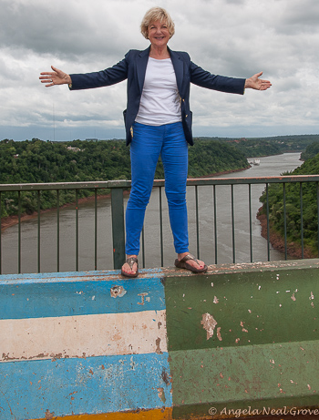Standing on the Friendship Bridge. Argentina on the left and Brazil on the right. the river is the natural border between the two countries