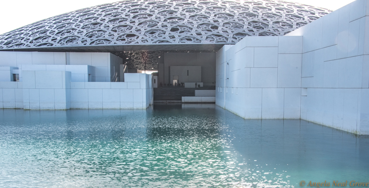 Abu Dhabi Louvre Breaks Boundaries Bridges Civilizations: image of the outside of the museum with its immense filigreed dome, designed by French architect Jean Nouvel.