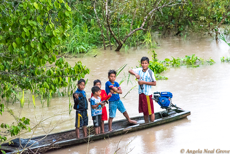 Amazon River Life: Each time we moored our boat for the night we would attract visitors. These five children stayed for a while chatting to crew members who gave them a Coca Cola. PHOTO: ANGROVE