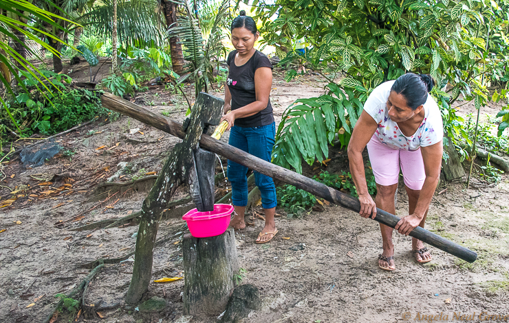 Amazon River Life: Here village women extract juice from sugar cane.//PHOTO: ANGROVE