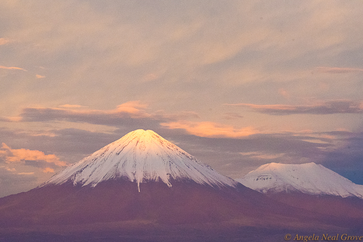Otherworldly Atacama Desert. Licancabur Volcano seen during a stormy sunset from the Explora Lodge roof terrace. The snowy white carapace is rare as there is usually not enough precipitation to create thick snow. Licancabur is a favorite volano to climb. PHOTO: AN GROVE