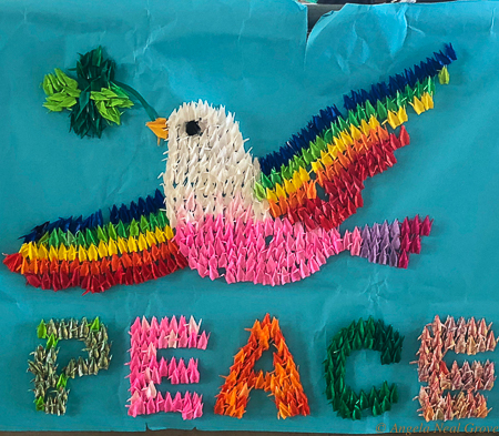 Symbol of peace with dove and rainbows in origami cranes. Cranes are a symbol of peace in Japan. This was made by children of Nagasaki. It is in the Bomb Museum. PHOTO//ANGROVE